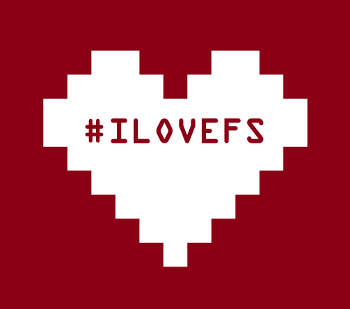 Logo ufficiale della giornata del software libero, rappresentato da un cuore pixellato bianco su uno sfondo rosso-marrone con la scritta #ILOVEFS